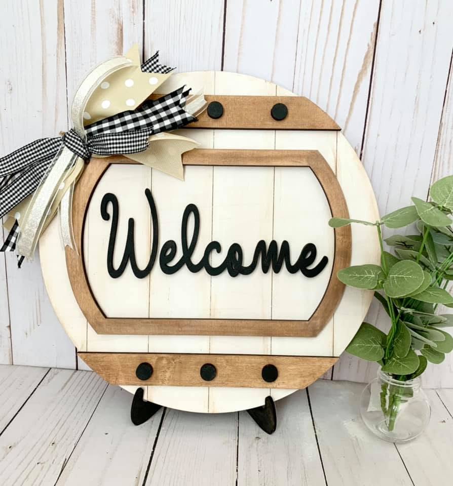 Finished IrreSIStible DIY Box welcome sign on its reusable display stand